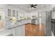 Bright kitchen featuring granite countertops, stainless steel appliances, and white cabinets at 922 Pebblebrook Se Rd, Mableton, GA 30126