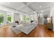 Spacious living room with hardwood floors, stylish furnishings, a fireplace, and plenty of natural light at 922 Pebblebrook Se Rd, Mableton, GA 30126