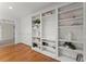 Bright living room with custom built-in shelving and hardwood floors, combining functionality and style for comfortable living at 922 Pebblebrook Se Rd, Mableton, GA 30126