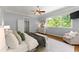 Bright primary bedroom with hardwood floors, large windows, and sitting area at 922 Pebblebrook Se Rd, Mableton, GA 30126
