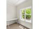 Small but bright office with a large window and modern white desk, ideal for working from home at 922 Pebblebrook Se Rd, Mableton, GA 30126