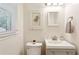 Clean and tidy bathroom featuring a mirror and a white vanity at 3344 Ridgecrest Dr, Powder Springs, GA 30127