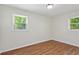 Bright bedroom featuring hardwood flooring and ample natural light through the windows at 3344 Ridgecrest Dr, Powder Springs, GA 30127