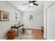 Bedroom with wood floors, ceiling fan, two windows, and a desk area for work or study at 3344 Ridgecrest Dr, Powder Springs, GA 30127