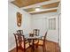 Cozy dining room area with a glass-topped table and decorative ceiling detail at 3344 Ridgecrest Dr, Powder Springs, GA 30127
