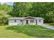 Charming single-story home with a well-maintained lawn and inviting front entrance at 3344 Ridgecrest Dr, Powder Springs, GA 30127