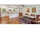 Open-concept living area featuring a kitchen with stainless steel appliances and wood flooring at 3344 Ridgecrest Dr, Powder Springs, GA 30127