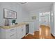 Butler's pantry featuring modern cabinetry, wood countertops, and a wine fridge at 4842 Mcpherson Ne Dr, Roswell, GA 30075