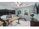 Office/bedroom featuring natural light, a ceiling fan, and workspace at 4842 Mcpherson Ne Dr, Roswell, GA 30075