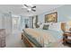 Comfortable bedroom featuring a ceiling fan and a ceiling light, with an ensuite bathroom at 4842 Mcpherson Ne Dr, Roswell, GA 30075