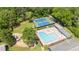 Aerial view of a community pool, tennis courts, playground, and spacious lounge area at 4842 Mcpherson Ne Dr, Roswell, GA 30075