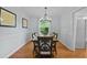Elegant dining room featuring a wooden table, upholstered chairs, and natural light at 4842 Mcpherson Ne Dr, Roswell, GA 30075