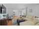 Spacious living room with comfortable seating, stylish decor, and hardwood flooring at 4842 Mcpherson Ne Dr, Roswell, GA 30075