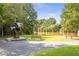 Scenic riverfront park featuring art, benches, and walking trails along the tranquil river at 4842 Mcpherson Ne Dr, Roswell, GA 30075