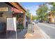 Sidewalk view with outdoor seating in front of Lola's Burger & Tequila Bar at 4842 Mcpherson Ne Dr, Roswell, GA 30075
