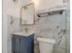 Bathroom featuring a blue vanity, white toilet and modern mirror at 537 Winton Ne Ter, Atlanta, GA 30308