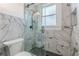 Bathroom featuring glass shower, black and white tile and modern hardware at 537 Winton Ne Ter, Atlanta, GA 30308