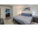 Cozy bedroom featuring neutral tones, stylish decor, and a view into the adjacent living area at 537 Winton Ne Ter, Atlanta, GA 30308