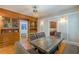 Formal dining room featuring built-in wood cabinetry, a modern light fixture, and hardwood floors at 537 Winton Ne Ter, Atlanta, GA 30308