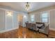 Casual dining room boasts hardwood floors, a rustic wood table, and modern lighting fixtures at 537 Winton Ne Ter, Atlanta, GA 30308