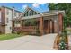Charming brick home with a covered front porch, beautifully landscaped yard, and a long driveway at 537 Winton Ne Ter, Atlanta, GA 30308