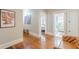 Hallway featuring hardwood floors, natural light, and access to the bedroom and bathroom at 537 Winton Ne Ter, Atlanta, GA 30308
