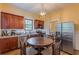 Eat-in kitchen featuring stainless steel appliances, wood cabinets and granite countertops, with laundry nearby at 537 Winton Ne Ter, Atlanta, GA 30308