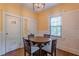 Cozy breakfast nook area with natural light, tiled wainscoting, and a view of the backyard at 537 Winton Ne Ter, Atlanta, GA 30308