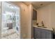 Convenient laundry room with sink, storage and a glimpse into an adjacent bathroom with stylish tile at 537 Winton Ne Ter, Atlanta, GA 30308