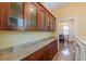 Spacious laundry room with granite countertops, wood cabinets, and modern appliances, perfect for functionality at 537 Winton Ne Ter, Atlanta, GA 30308