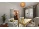 Bright office space with French doors, stylish light fixture, neutral colors, and window views at 537 Winton Ne Ter, Atlanta, GA 30308
