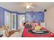 This bedroom is decorated with colorful items, hard wood floors, and bright accents at 1588 Peachtree Cir, Lawrenceville, GA 30043