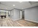 Spacious basement area with wood flooring, neutral paint, and a pool table in an open floor plan at 4445 Ansley Ln, Cumming, GA 30040