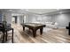 Large finished basement featuring a pool table, living area, and luxury vinyl plank flooring at 4445 Ansley Ln, Cumming, GA 30040