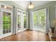 Bright breakfast nook features hardwood floors, large windows, and access to the deck, perfect for dining at 4445 Ansley Ln, Cumming, GA 30040