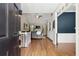 Inviting living room with high ceilings, hardwood floors, and a cozy fireplace at 4445 Ansley Ln, Cumming, GA 30040