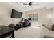 Bright home office space with a large window, neutral carpeting, and two work areas at 4445 Ansley Ln, Cumming, GA 30040