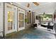 Covered outdoor patio offers seating, string lights, and ceiling fans, great for relaxation and entertainment at 4445 Ansley Ln, Cumming, GA 30040