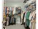 Spacious walk-in closet with ample storage shelves and rods for hanging clothing at 4445 Ansley Ln, Cumming, GA 30040
