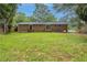 Lovely backyard and brick home provide an ideal blend of space and natural beauty for outdoor enjoyment at 5964 W Fayetteville Rd, Atlanta, GA 30349