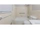 Bathroom featuring a shower-tub combo, toilet, sink and a window at 5964 W Fayetteville Rd, Atlanta, GA 30349