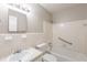 This bathroom features vanity and mirror, shower-tub combo, and toilet at 5964 W Fayetteville Rd, Atlanta, GA 30349