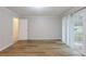 Spacious bedroom featuring wood-look floors, natural light and an ensuite at 5964 W Fayetteville Rd, Atlanta, GA 30349