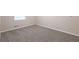 This bedroom features neutral walls and plush gray carpet at 5964 W Fayetteville Rd, Atlanta, GA 30349