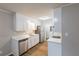 Bright kitchen featuring stainless steel appliances, white cabinets, and modern countertops at 5964 W Fayetteville Rd, Atlanta, GA 30349