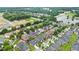 Drone shot of neighborhood with lake and trees at 663 Warm Springs Ct, Loganville, GA 30052