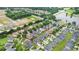 Aerial view of community and new construction with beautiful landscaping near pond at 663 Warm Springs Ct, Loganville, GA 30052