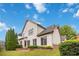 This home's backyard features a well-manicured lawn, brick patios, and mature trees for privacy at 663 Warm Springs Ct, Loganville, GA 30052