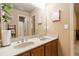 Bathroom featuring double sink vanity with granite countertops and decor at 663 Warm Springs Ct, Loganville, GA 30052