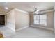 Bedroom with neutral colors, plush carpet, and a window creates a serene and relaxing space at 663 Warm Springs Ct, Loganville, GA 30052